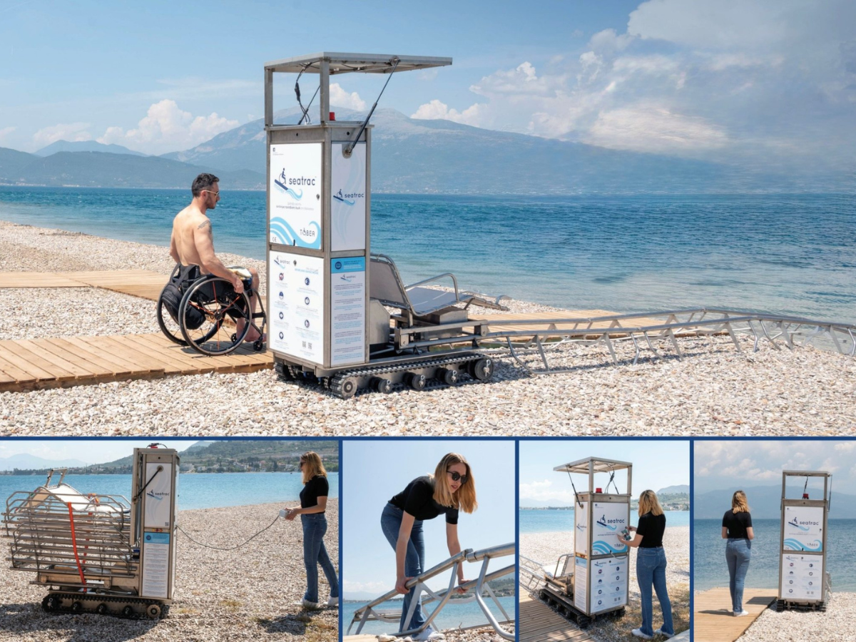 Ein Mann im Rollstuhl fährt über einen Holzsteg auf die solarbetriebene Seatrac-Station zu, von der ein Schienensystem ins Meer führt.